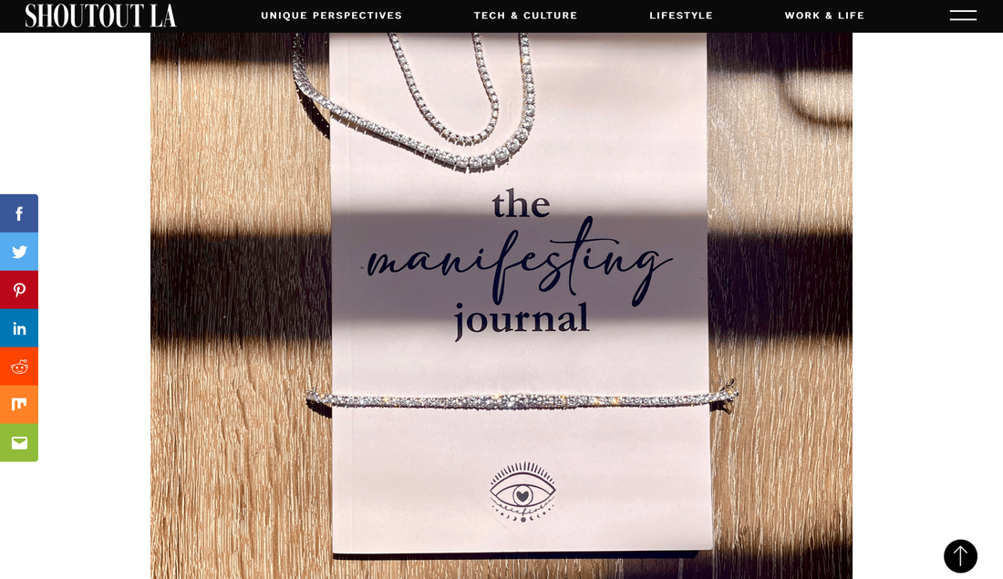 Tennis necklaces and tennis bracelet displayed on the cover of the manifesting journal