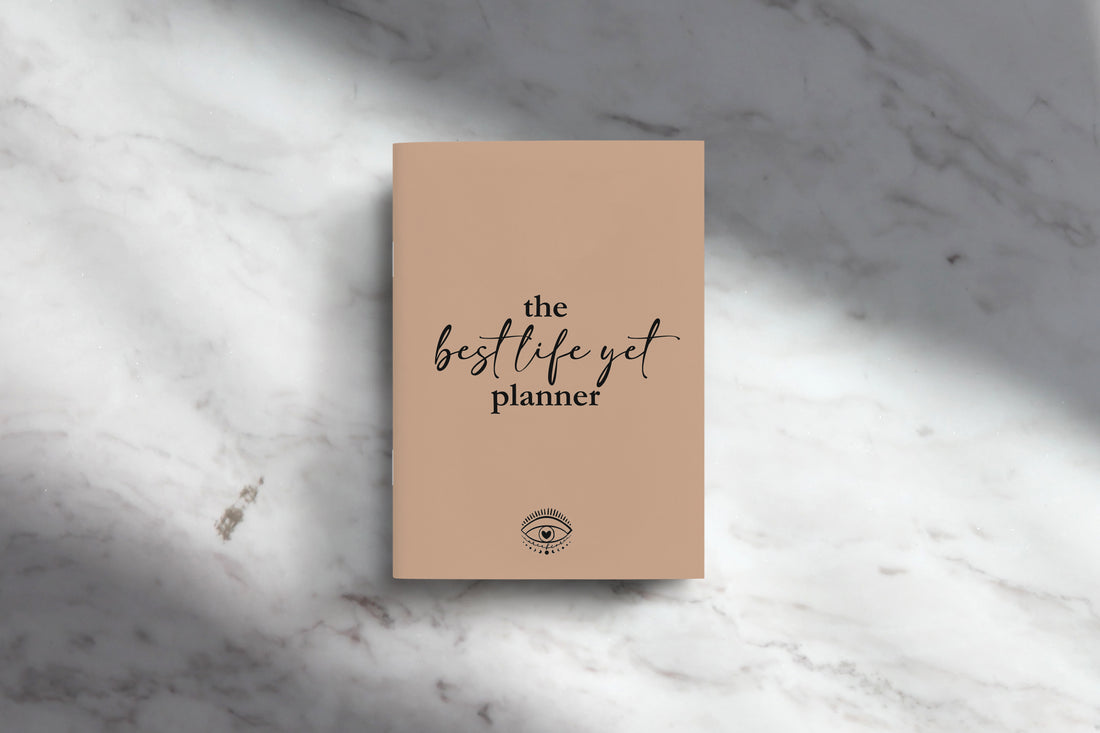 Cover of the best life yet planner displayed on a marble counter